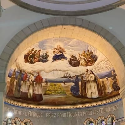 The apse of Notre-Dame d'Afrique, its mural inscribed with a prayer for Christians and Muslims