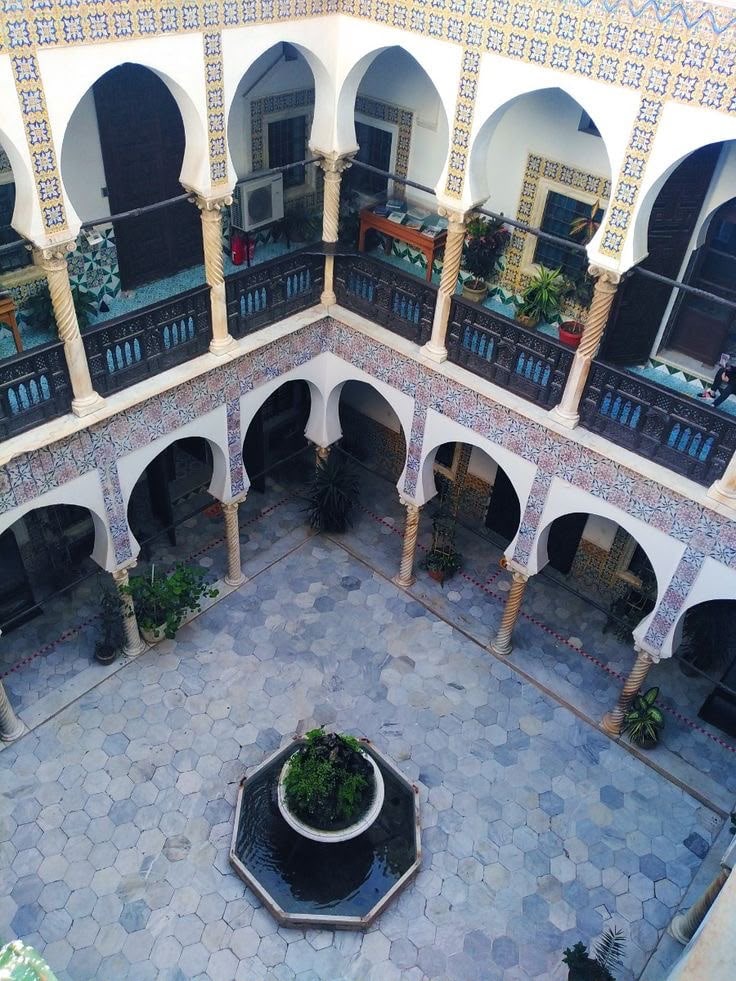 Looking down into the tiled courtyard of an Ottoman palace in the Casbah from its upper gallery