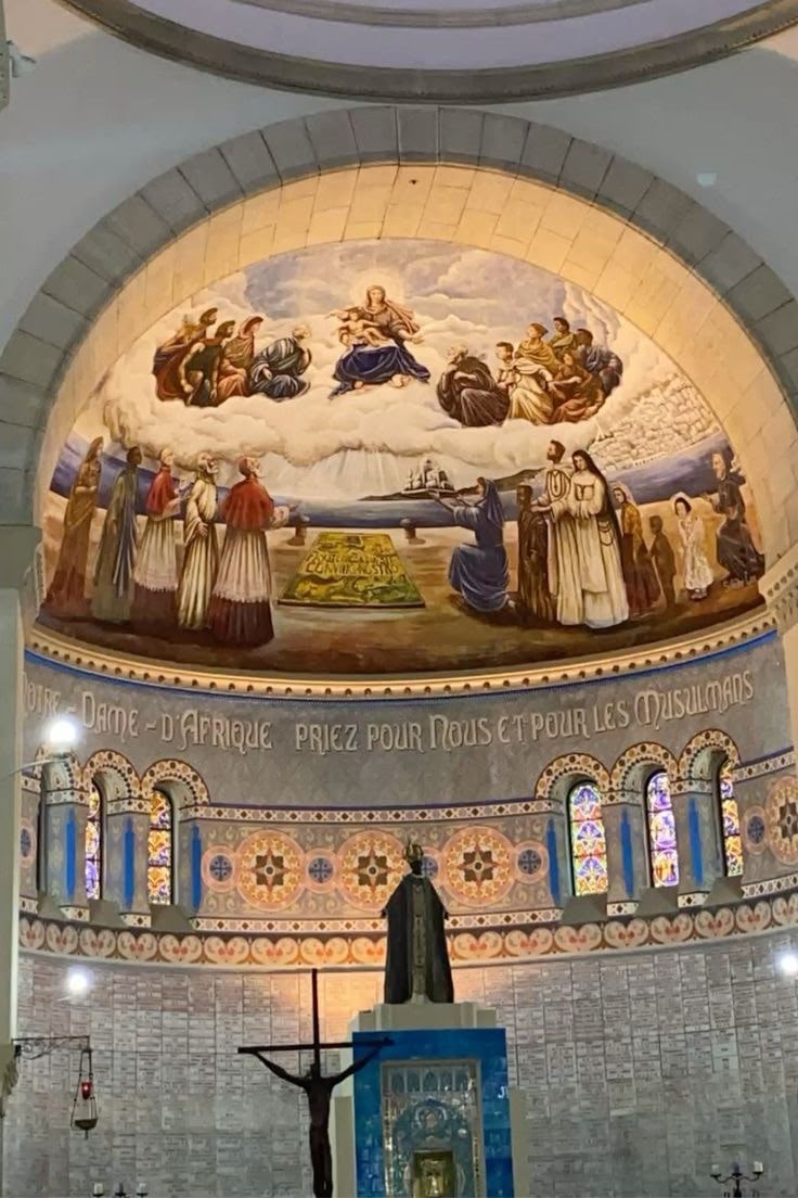 The apse of Notre-Dame d'Afrique, its mural inscribed with a prayer for Christians and Muslims
