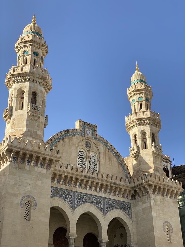 The twin minarets and carved façade of the Ketchaoua Mosque at the foot of the Casbah